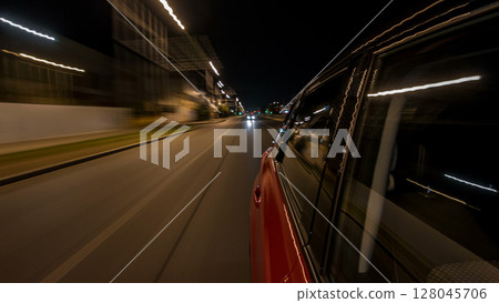 Drivelapse from side of car moving on a night avenue in city timelapse hyperlapse Drivelapse from side of car moving on a night avenue in city timelapse hyperlapse 128045706