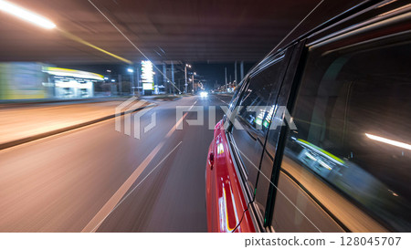 Drivelapse from side of car moving on a night avenue in city timelapse hyperlapse 128045707