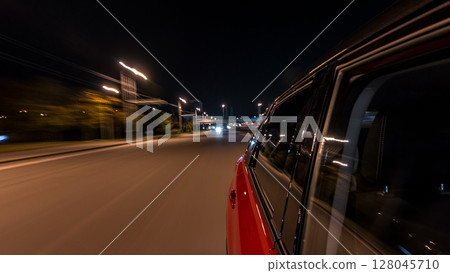 Drivelapse from side of car moving on a night avenue in city timelapse hyperlapse Drivelapse from side of car moving on a night avenue in city timelapse hyperlapse 128045710