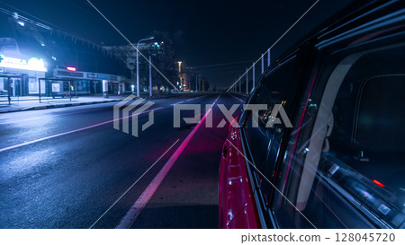 Drivelapse urban look from fast driving car at a night avenue in a city timelapse hyperlapse Drivelapse urban look from fast driving car at a night avenue in a city timelapse hyperlapse 128045720