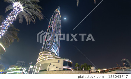 Hotel witin Moon in the downtown Dubai area overlooks the famous dancing fountains in Dubai, UAE. Timelapse 128045747