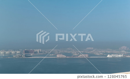 View on artificial island Palm Jumeirah in Dubai, UAE timelapse 128045765