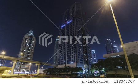 Skyscrapers at the Sheikh Zayed Road night in Dubai timelapse hyperlapse Skyscrapers at the Sheikh Zayed Road night in Dubai timelapse hyperlapse 128045767