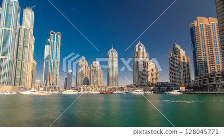 Dubai Marina with tallest skyscrapers and boats timelapse hyperlapse Dubai Marina with tallest skyscrapers and boats timelapse hyperlapse 128045771