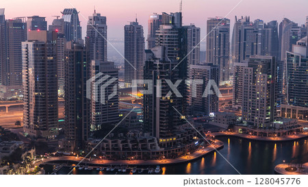 Dubai marina harbor panorama from night to day transition timelapse 128045776