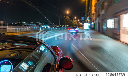 Car moves at fast speed at the night streets timelapse hyperlapse drivelapse. 128045789