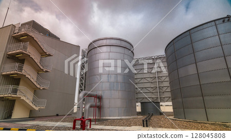Two silver Water Tanks with fence timelapse hyperlapse Two silver Water Tanks with fence timelapse hyperlapse 128045808