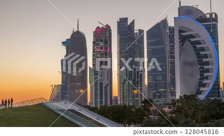 The high-rise district of Doha day to night timelapse after sunset 128045816