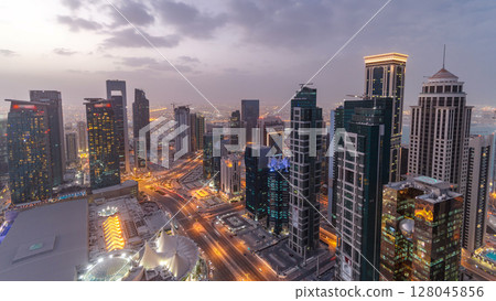 The skyline of the West Bay area from top in Doha day to night timelapse, Qatar. 128045856