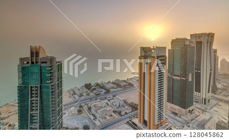 The skyline of West Bay and Doha City Center during sunrise timelapse, Qatar The skyline of West Bay and Doha City Center during sunrise timelapse, Qatar 128045862