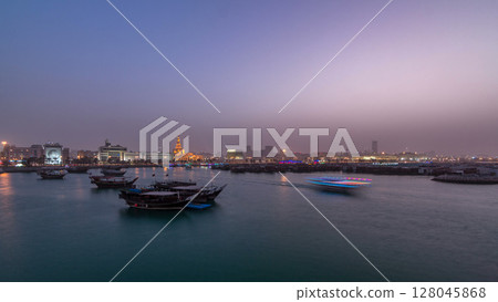 Evening at Doha Bay day to night timelapse with Traditional Wooden Dhow Fishing Boats. Evening at Doha Bay day to night timelapse with Traditional Wooden Dhow Fishing Boats. 128045868