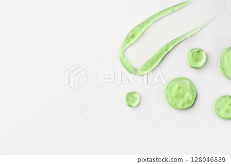 Cosmetic gel drops on a white background 128046889