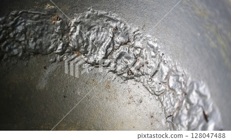 Damaged Interior of a Pot: Peeling, Cracking, and Bubbling of Non-Stick Coating Revealed 128047488