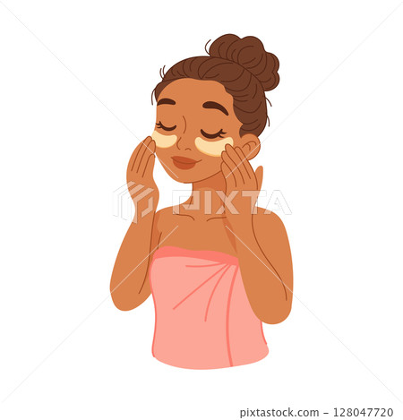 Black woman using under eye patches for skincare 128047720
