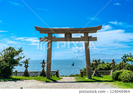 Iwatohime Shrine: Torii gate facing the sea and the Seto Inland Sea in early autumn 8. Ako City, Hyogo Prefecture Iwatohime Shrine: Torii gate facing the sea and the Seto Inland Sea in early autumn 8. Ako City, Hyogo Prefecture 128048964