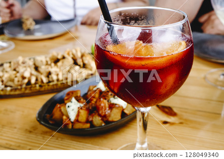 sangria with tapas on shared wooden table sangria with tapas on shared wooden table 128049340