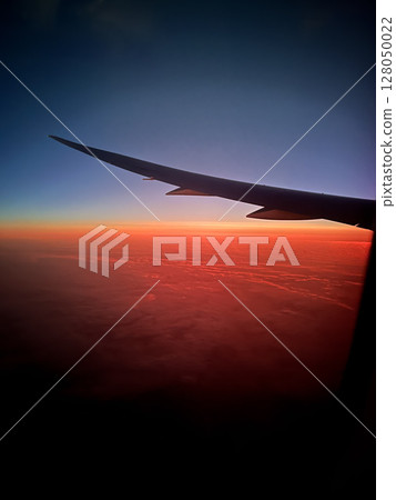 A sunset glow seen from an airplane 128050022