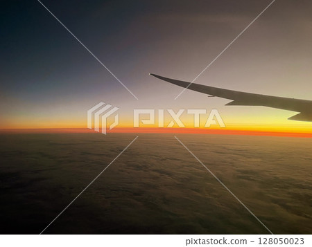 A sunset glow seen from an airplane 128050023