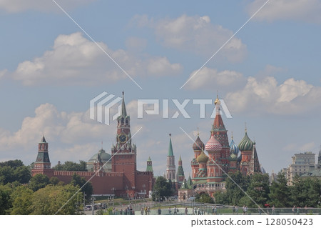 Moscow, Russia - July 25, 2022: Spasskaya Tower of the Kremlin, St. Basil's Cathedral Moscow, Russia - July 25, 2022: Spasskaya Tower of the Kremlin, St. Basil's Cathedral 128050423