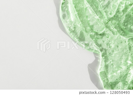Cosmetic smear gel texture on a white background 128050493