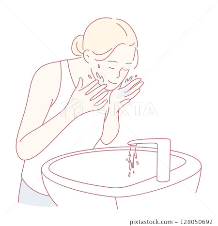 A Person Engaging in the Ritual of Washing their Face at the Sink for an Effective Skincare Routine A Person Engaging in the Ritual of Washing their Face at the Sink for an Effective Skincare Routine 128050692