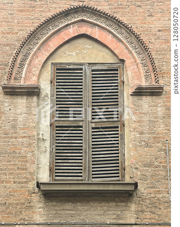 Medieval window of Italian buildigns with closing doors in wood 128050720