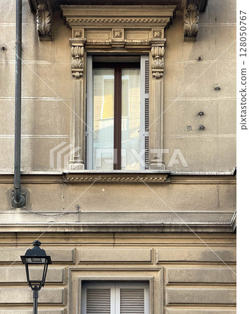 Traditional window of Italian buildigns with closing doors in wood 128050767