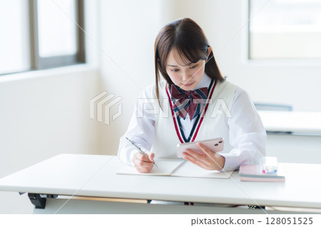 Students studying in classroom Students studying in classroom 128051525
