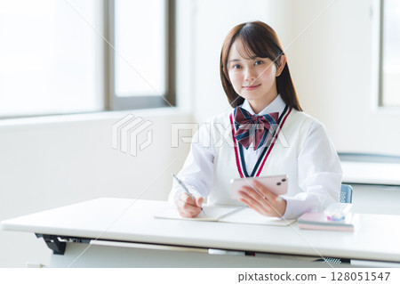 Students studying in classroom Students studying in classroom 128051547