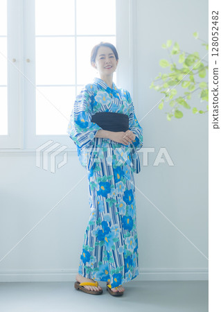 A woman in a yukata by the window A woman in a yukata by the window 128052482