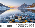 Body of water with a rocky shoreline 128053494
