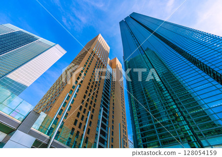 Tokyo cityscape, Japan, July 4th. View of the Shiodome office buildings, including Shiodome Tower and Nippon TV Tower. 128054159