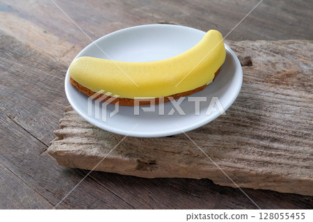 sweet and delicious choco banana cake on white dish. sweet and delicious choco banana cake on white dish. 128055455