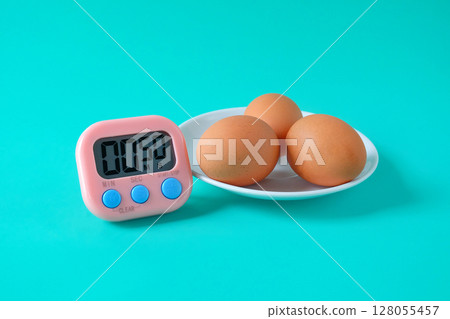 Brown egg boiled with Egg timer,Kitchen tool. Brown egg boiled with Egg timer,Kitchen tool. 128055457