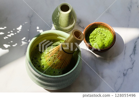 Ceremonial Matcha Setup. Traditional matcha tea set with powder, bamboo whisk Ceremonial Matcha Setup. Traditional matcha tea set with powder, bamboo whisk 128055496