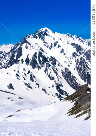 Mount Tsurugi and Tsurugisawa seen from the summit of the southern peak of Mount Betsuyama. Climbing Mount Tateyama and Mount Betsuyama in the Northern Alps in the snow season 128055676