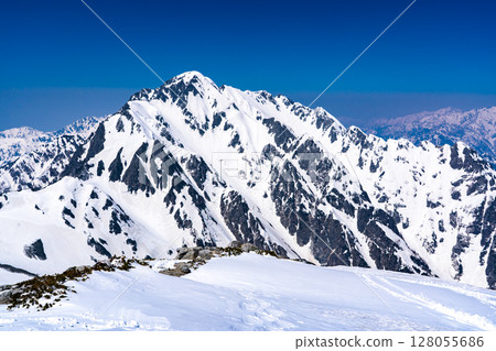 View of Mount Tsurugi and Mount Yatsumine from the summit of Mount Betsuyama's northern peak. Climbing Mount Tateyama and Mount Betsuyama in the Northern Alps during the remaining snow season. 128055686