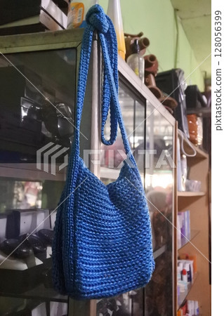 blue knitted bag blue knitted bag 128056399