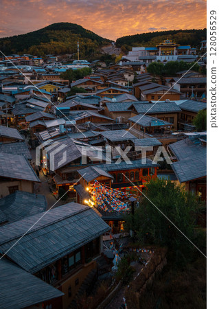 Vibrant Sunset Over Dukezong Ancient Town in Shangri-La, China 128056529