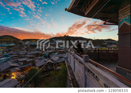 View of Shangri-La's Old Town from a Traditional Balcony at Sunset 128056533