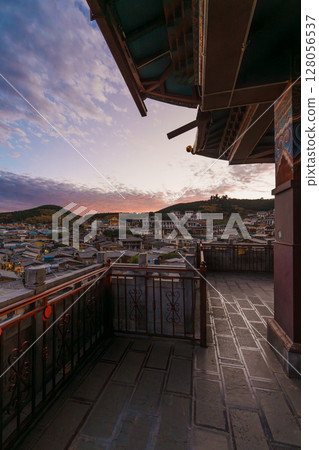 View of Shangri-La's Old Town from a Traditional Balcony at Sunset View of Shangri-La's Old Town from a Traditional Balcony at Sunset 128056537