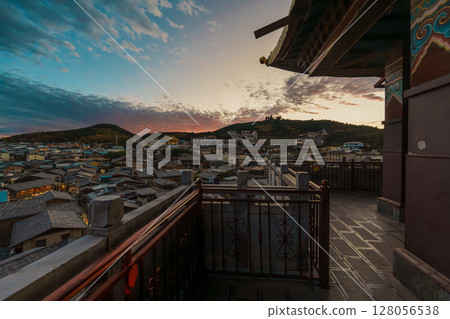 View of Shangri-La's Old Town from a Traditional Balcony at Sunset 128056538