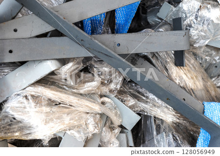 Construction debris and waste close-up. Waste metal is kissed on a construction site. Construction debris and waste close-up. Waste metal is kissed on a construction site. 128056949
