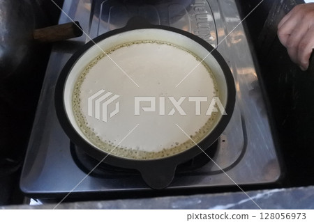 Martabak dough a typical Indonesian food that is cooked 128056973