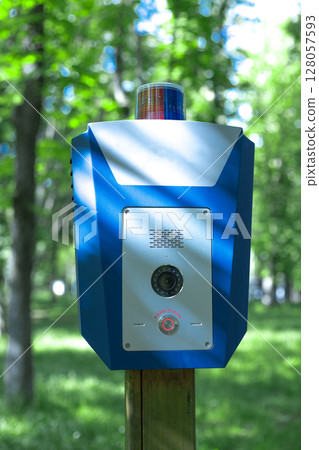 Panic alarm for call to police, emergency button in public park. 128057593
