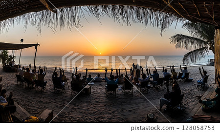 A group of people are gathered on a beach A group of people are gathered on a beach 128058753