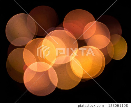 Orange and Gold Bokeh Lights on Dark Background 128061108