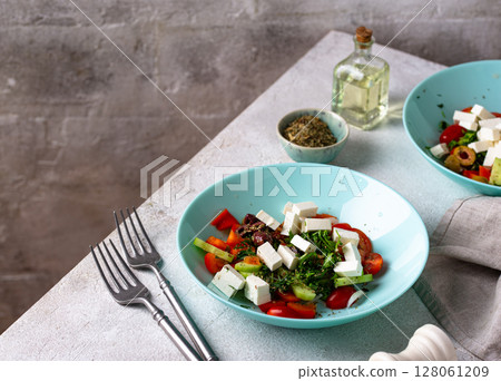 Greek salad with vegetables, olives and feta cheese Greek salad with vegetables, olives and feta cheese 128061209