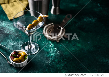 Traditional martini cocktail with olives and Traditional martini cocktail with olives and 128061210