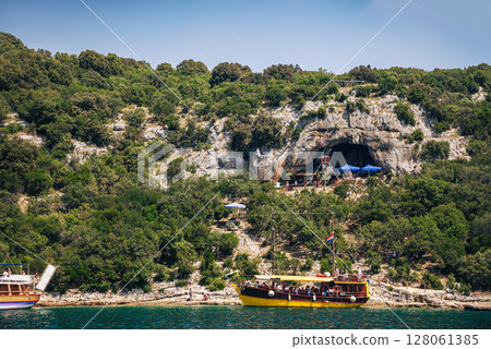 Panoramic tour old town of Rovinj, Lim Fjord, Croatia. Aquaculture fish farm mountainous setting. 128061385